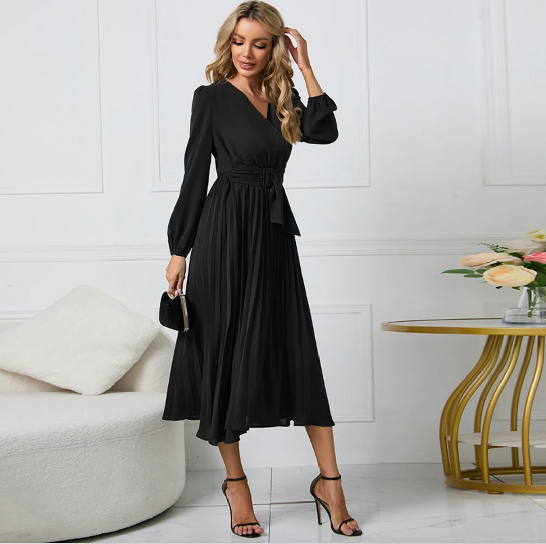 Woman modeling a chic blazer dress, perfect for modern office attire or an elegant night out.