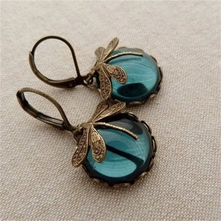 Colorful women's drop earrings: enchanting sterling silver dragonflies with radiant moonstones.