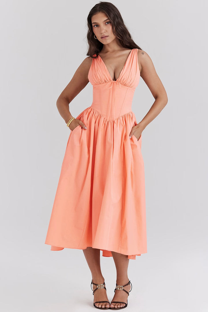 Stylish women's floral summer dress, a short sleeve midi length design with convenient side pockets.