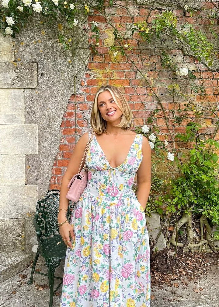 Feminine elegant floral summer dress with pockets, designed for comfort and versatile wear.