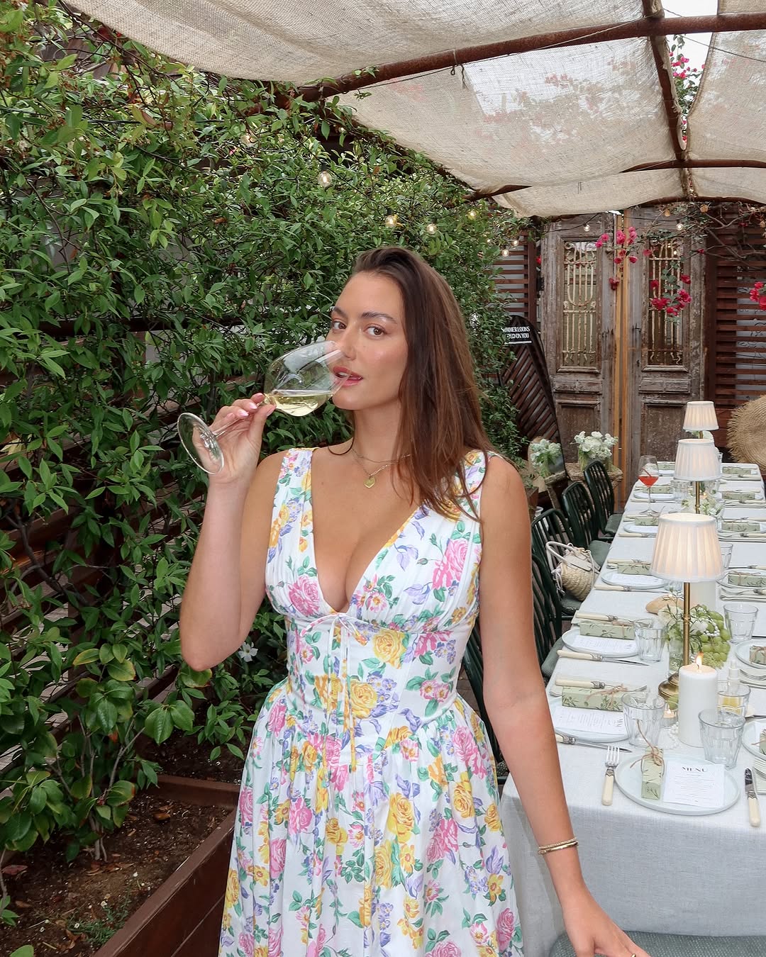 Gorgeous floral summer party dress for women, featuring a comfortable midi cut and functional pockets.