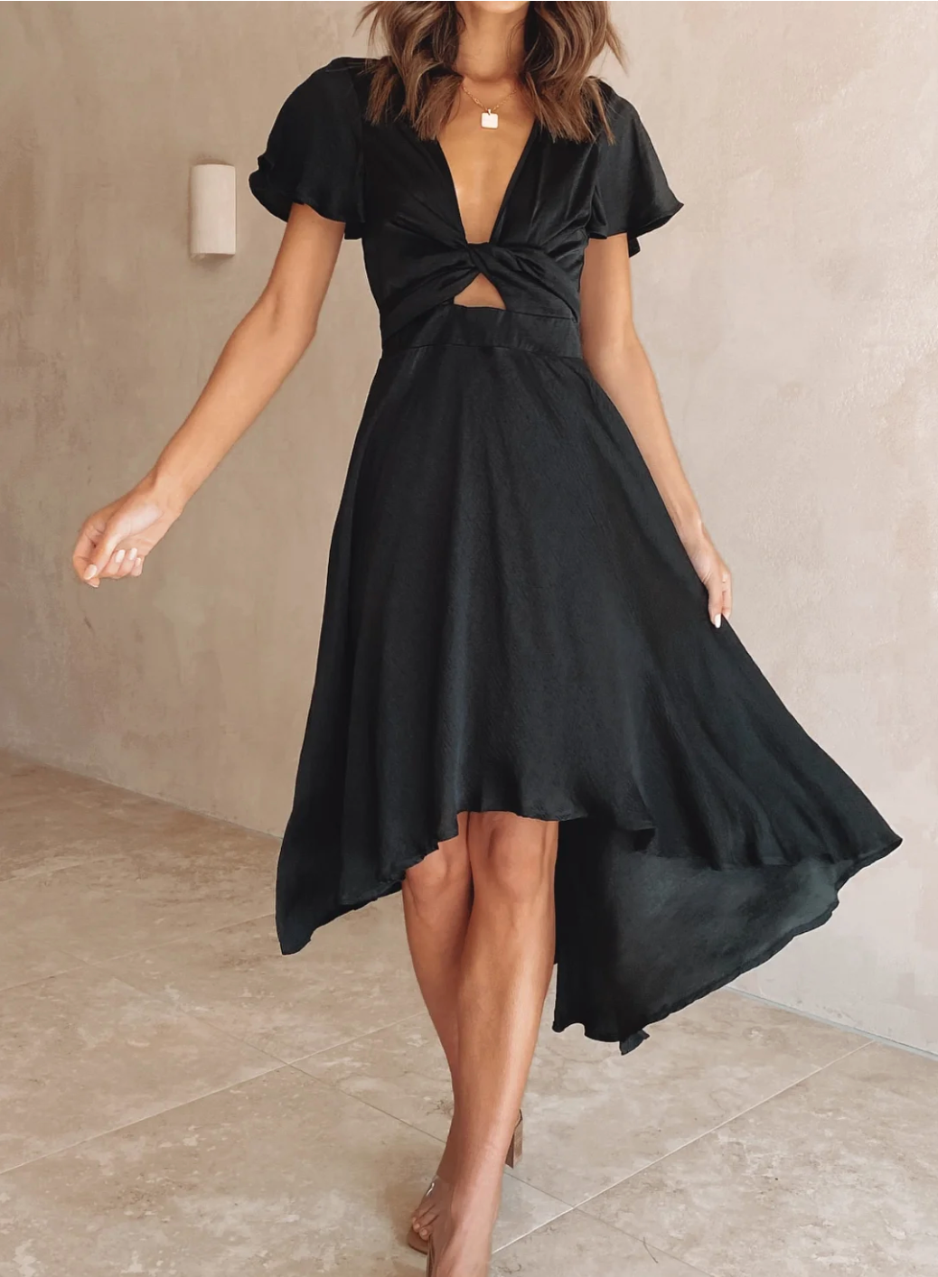 Women's elegant Amira flowy midi dress with short sleeves, perfect for summer casual wear or a wedding guest.