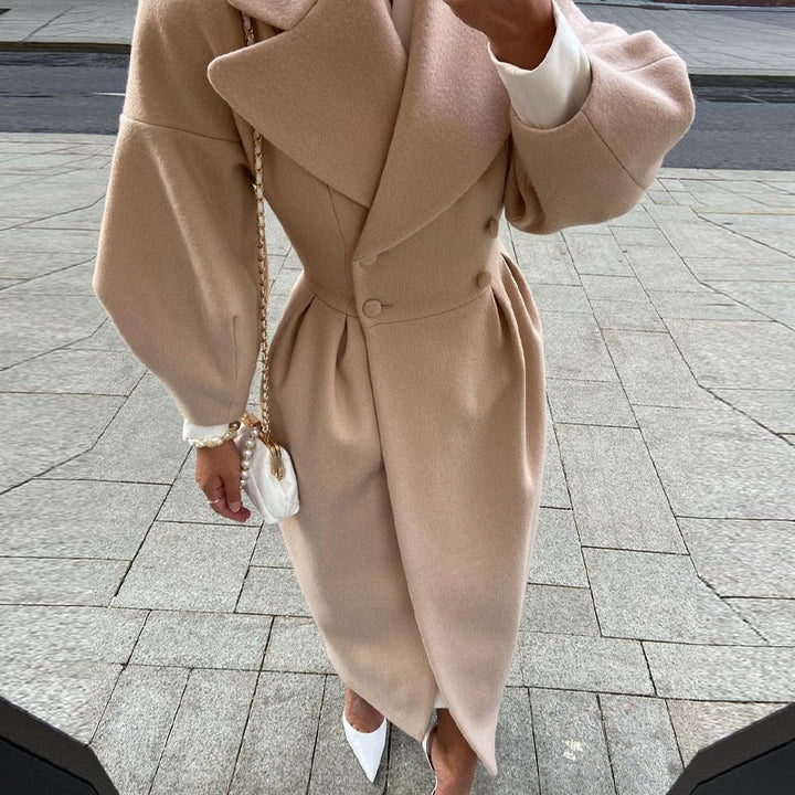 Timeless women's double-breasted long wool coat, ideal for elegant autumn style.