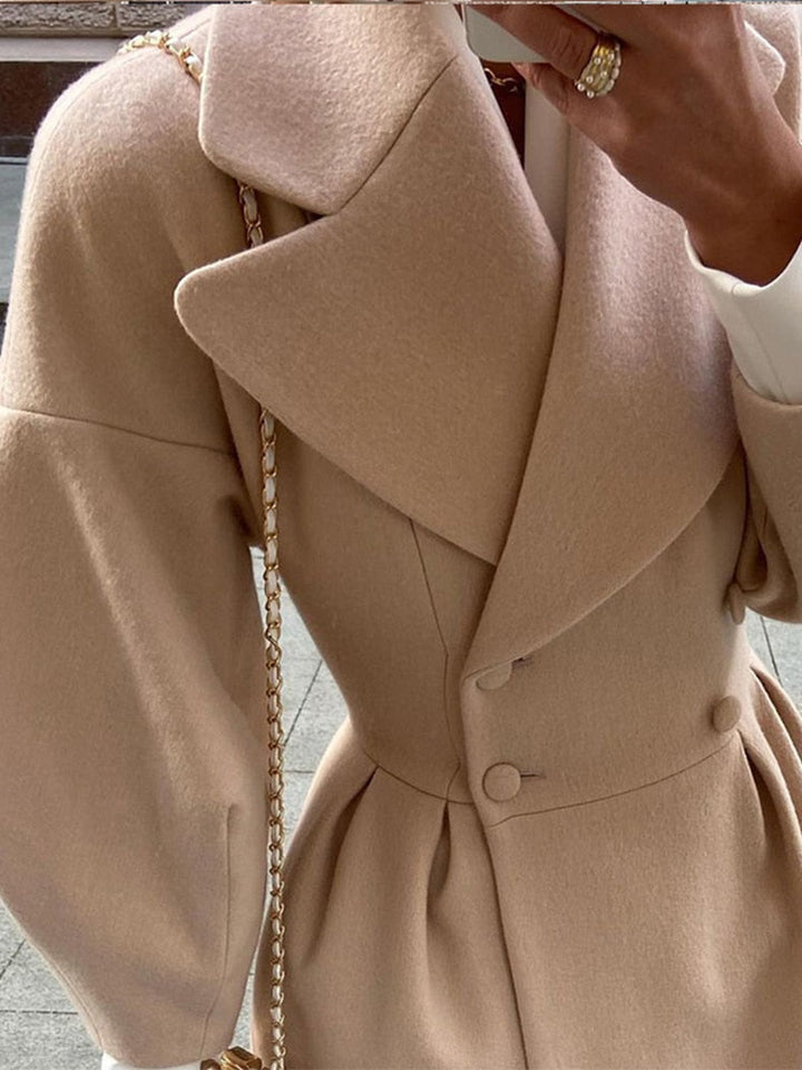 Fashionable women's long coat, double-breasted and warm for elegant autumn style.