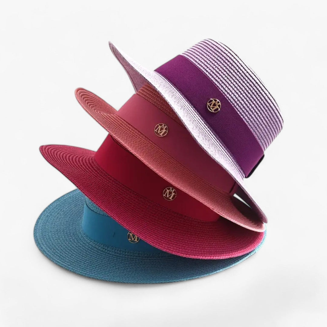 Elegant women's straw sun hat with a wide brim for maximum UV protection & stylish summer wear.