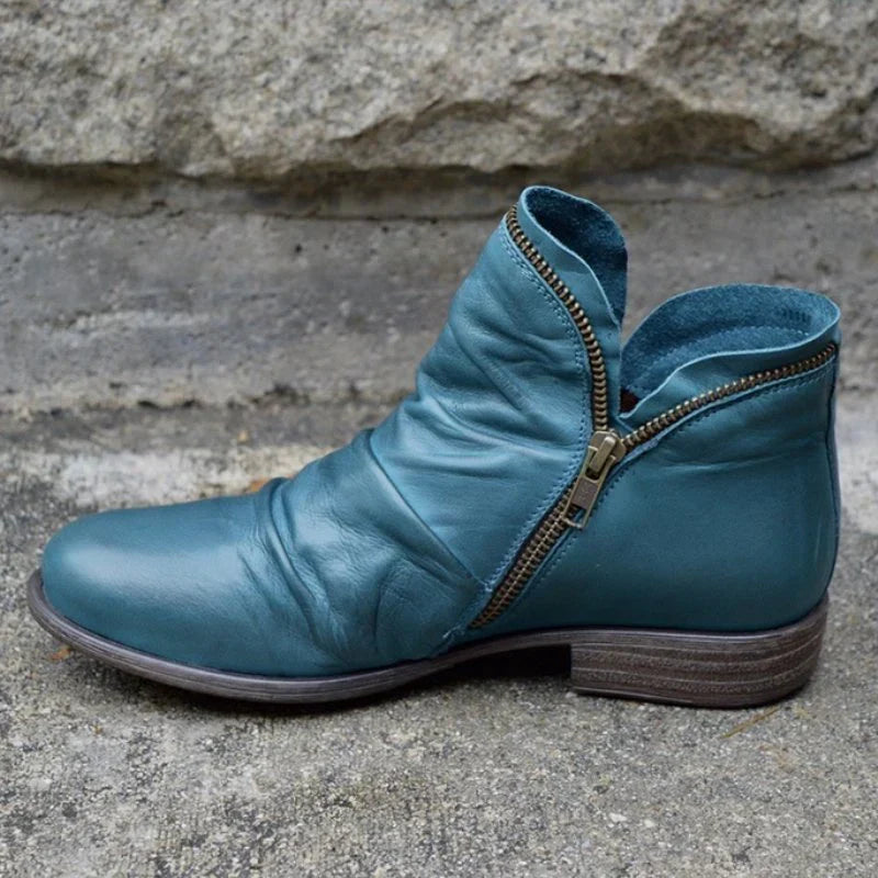 Comfortable women's orthopedic ankle boots for fall/winter. Features elegant ruffle & easy side-zip.