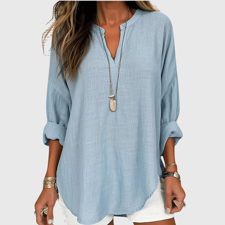 Graceful women's V-neck tunic shirt with relaxed long sleeves for casual everyday style.