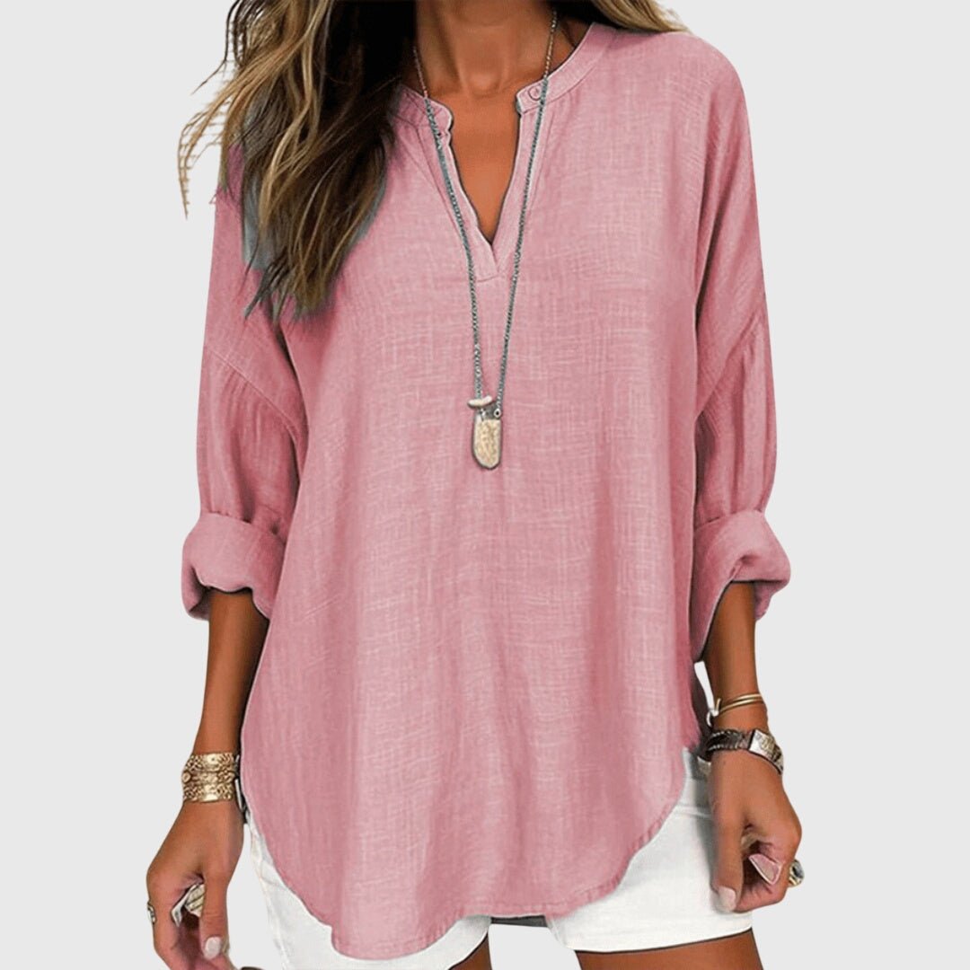 Elegant women's V-neck tunic with graceful long sleeves, a versatile top for any occasion.