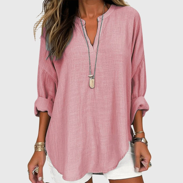 Elegant women's V-neck tunic with graceful long sleeves, a versatile top for any occasion.