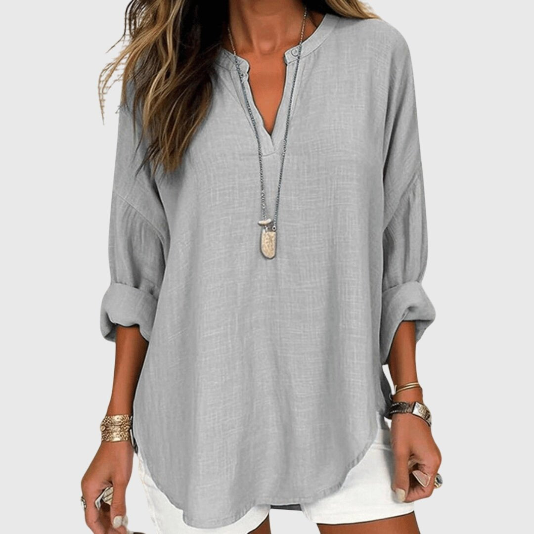 Casual women's long sleeve V-neck tunic shirt in a relaxed fit, perfect for breezy summer days.