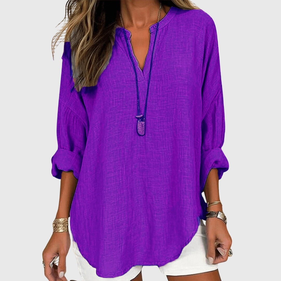 Everyday women's V-neck tunic top with comfortable long sleeves and a relaxed, flowing fit.