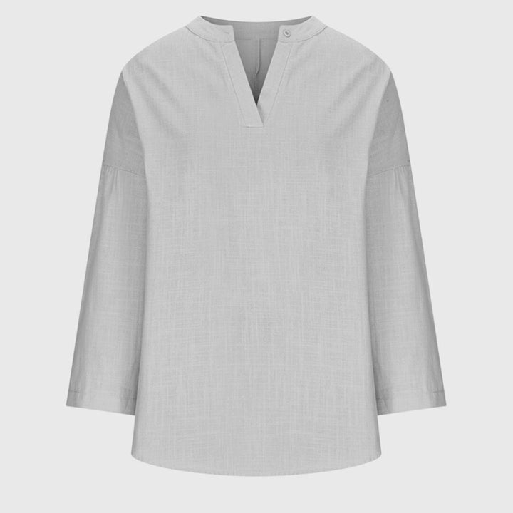 Versatile women's V-neck tunic shirt, long sleeve and relaxed, a perfect summer or casual staple.