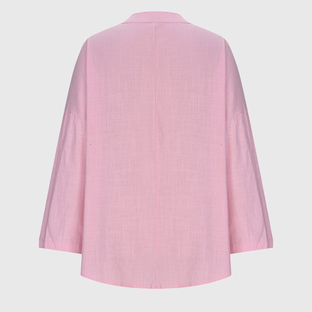 Stylish women's V-neck tunic with relaxed long sleeves, great for casual elegance and comfort.