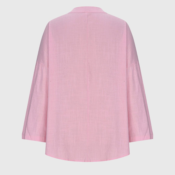 Stylish women's V-neck tunic with relaxed long sleeves, great for casual elegance and comfort.