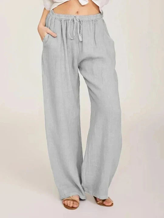 Women's chic wide leg pants with comfortable drawstring waist, perfect for casual summer wear and travel.
