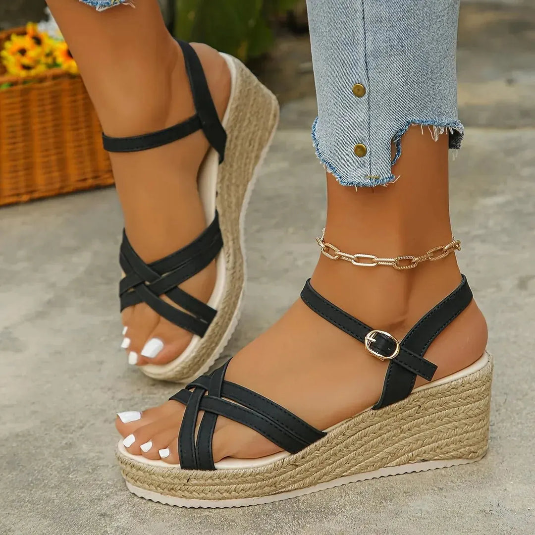 Women's espadrille wedge sandals featuring strappy design and platform, perfect for summer.