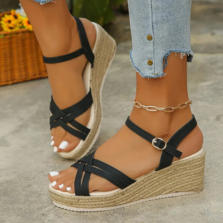 Women's espadrille wedge sandals featuring strappy design and platform, perfect for summer.