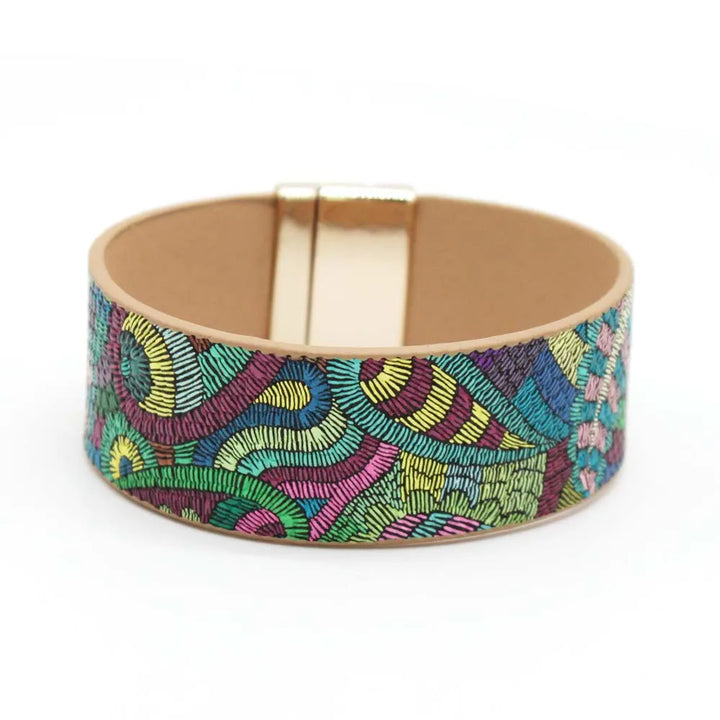 Stylish women's leather wrap bracelet, ethnic design. Adjustable boho chic jewelry, perfect for any outfit.