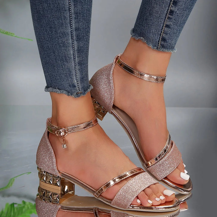 Elegant women's Evadne summer sandals with a sturdy block heel & chic ankle strap. Comfortable heeled footwear.