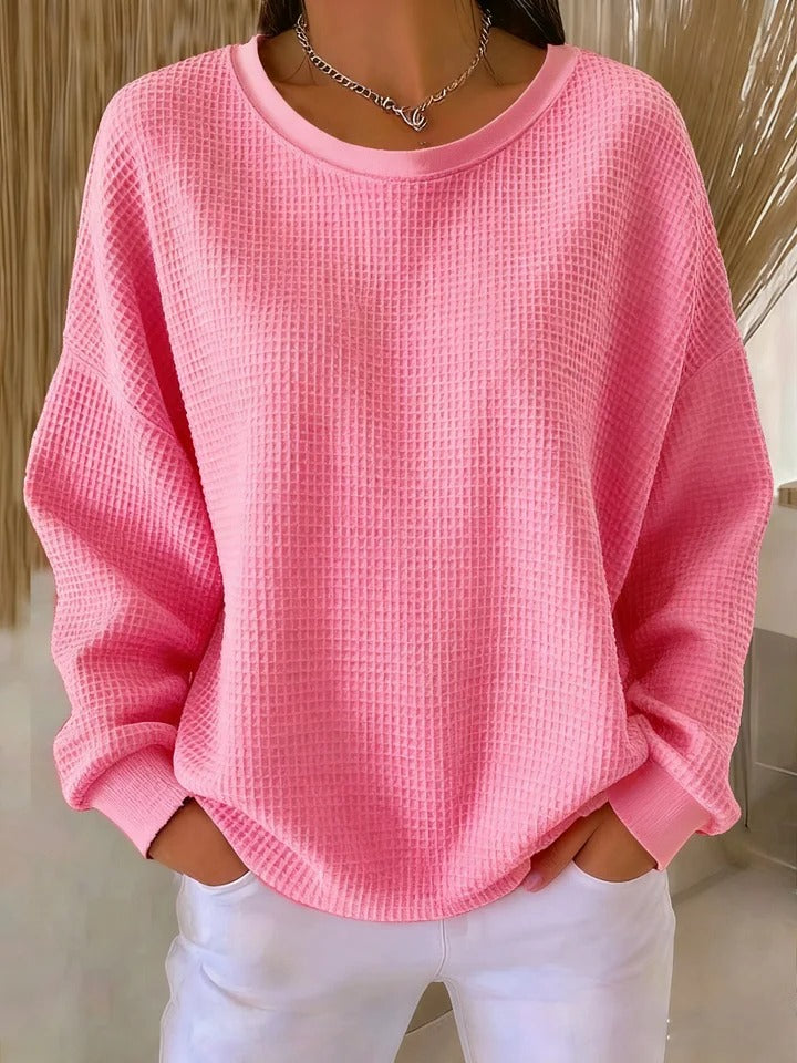 Premium women's cozy round neck sweater, featuring a stylish texture and long sleeves.