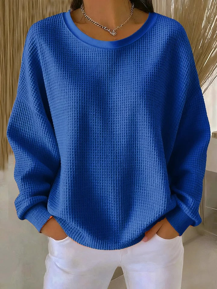 Comfortable women's round neck sweater with a unique textured knit and long sleeves.