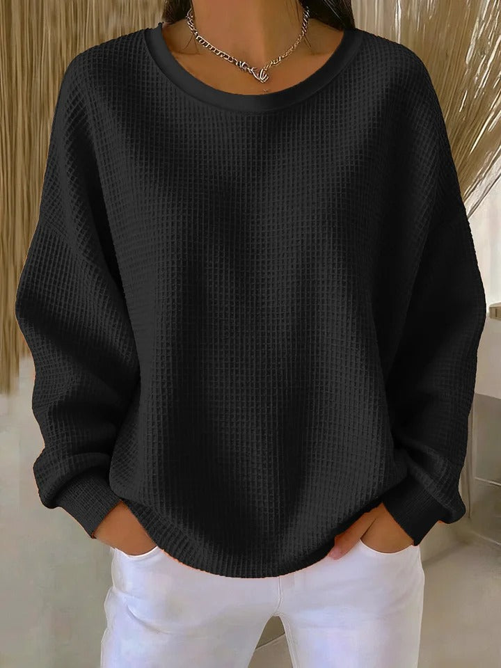 Versatile women's round neck textured sweater, offering a relaxed fit and warm long sleeves.