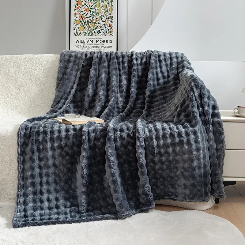 Luxurious bubble flannel throw blanket, providing ultimate softness & warmth. A cozy addition to any room.