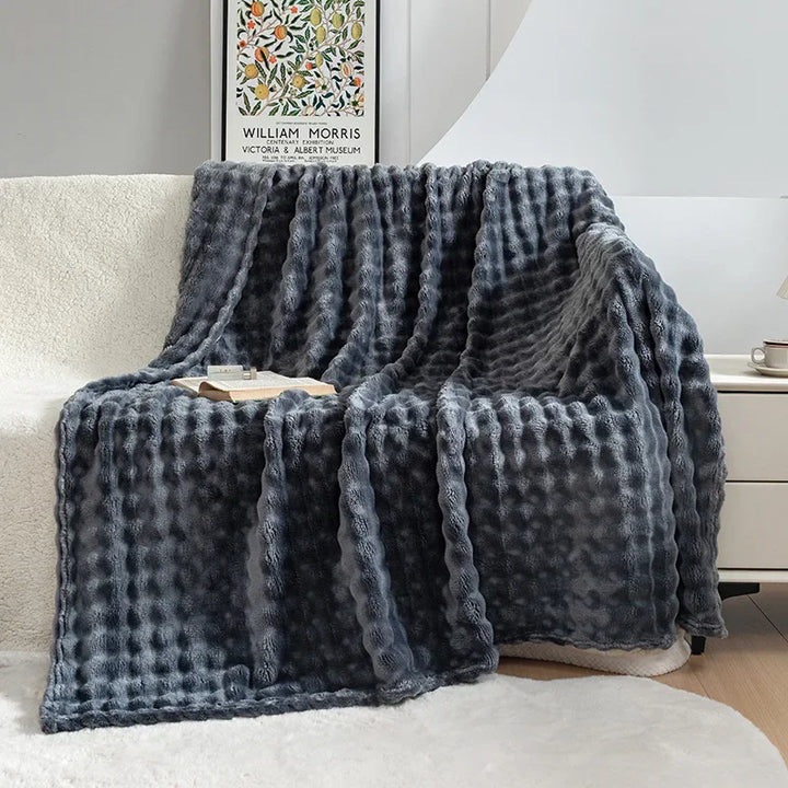 Luxurious bubble flannel throw blanket, providing ultimate softness & warmth. A cozy addition to any room.