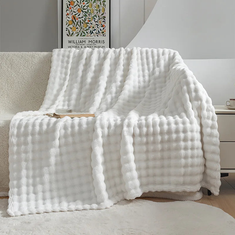 Plush bubble flannel throw blanket, an extra soft & warm comfort blanket for home decor.
