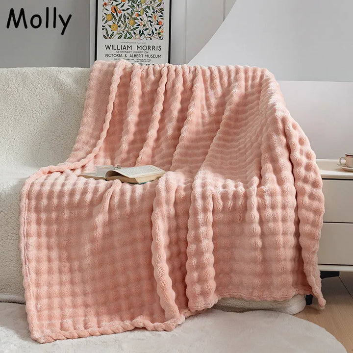 Ultra soft bubble flannel throw blanket, perfect for cozy comfort in your living room or bedroom.