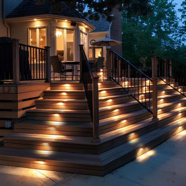 Waterproof Nvroome solar step light mounted on a fence, providing energy-saving pathway illumination.