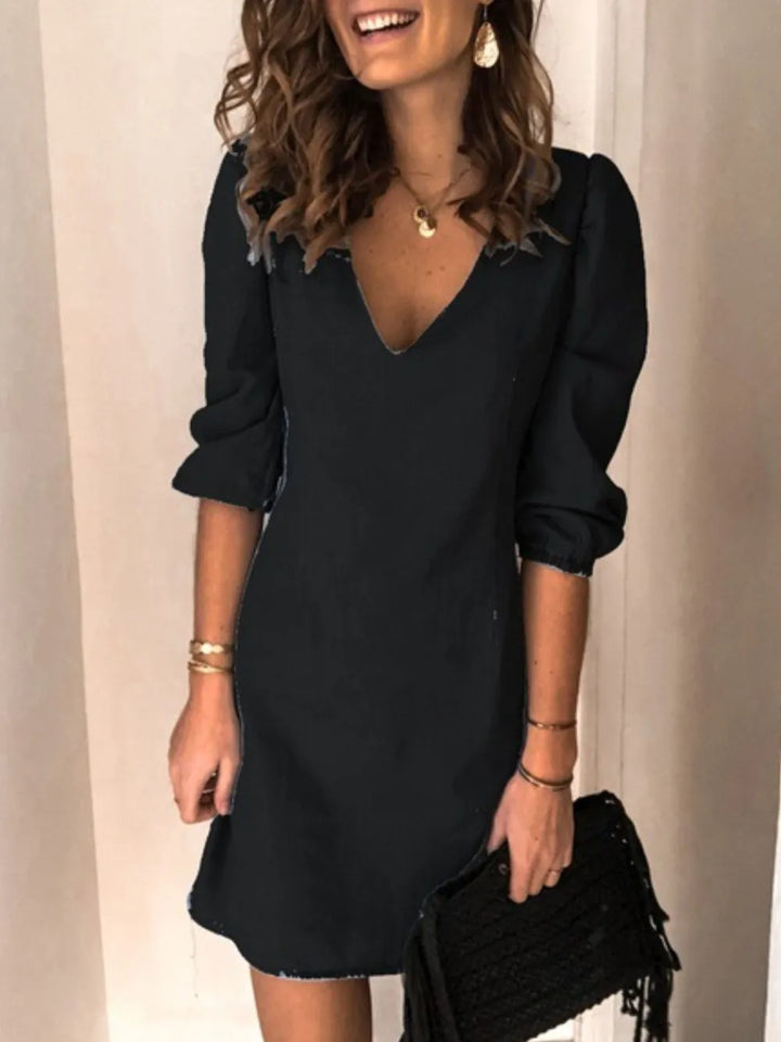 Elegant V-neck half sleeve dress for women, offering a flattering silhouette for various events.