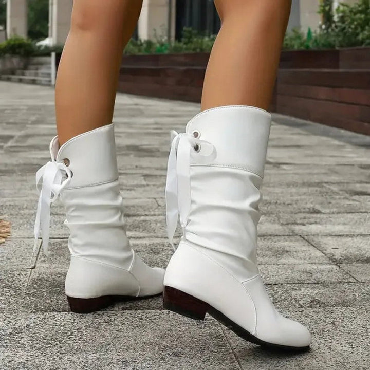 Chic women's lace-up slouchy ankle boots with a block heel. Essential fall fashion for a comfortable, stylish look.