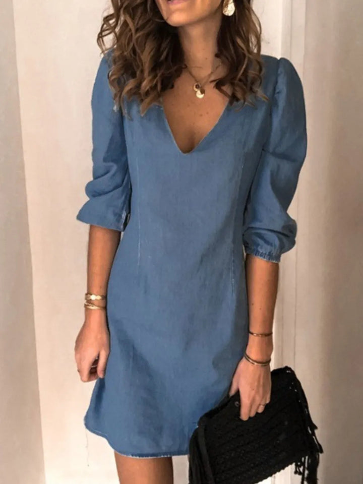 Stylish red V-neck casual dress with half sleeves, perfect for warm weather and parties.