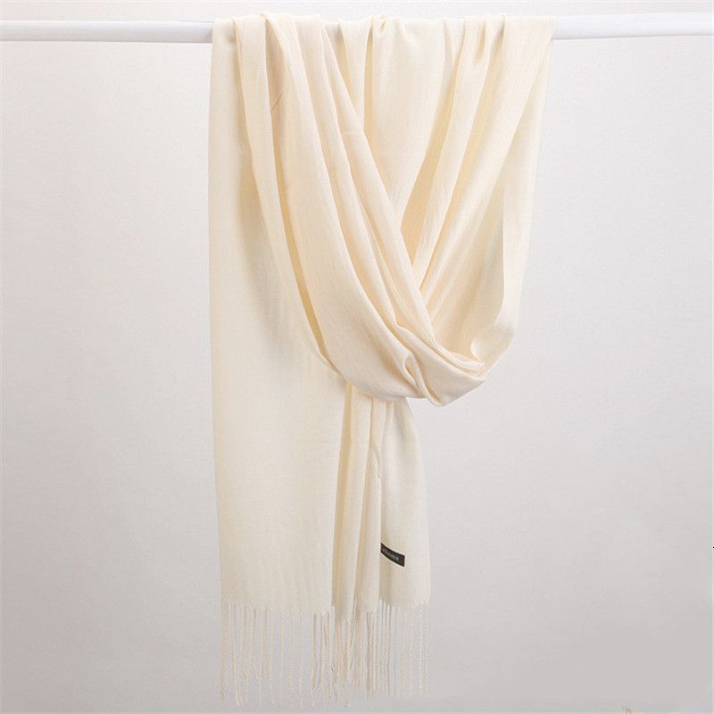 Cozy solid color cashmere scarf, a luxurious and soft winter accessory for elegant outfits.