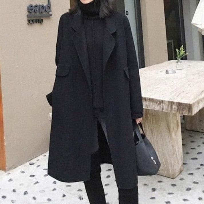 Warm knee-length women's winter coat, perfect for stylish cold weather fashion. Elegant and cozy long outerwear.