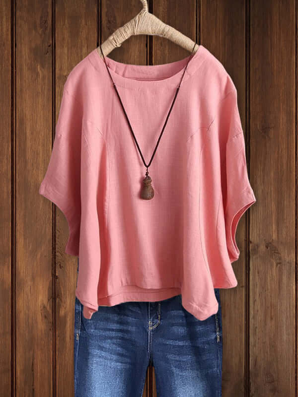 Chic women's dolman sleeve tunic top featuring a comfortable crew neck, perfect for casual elegance.