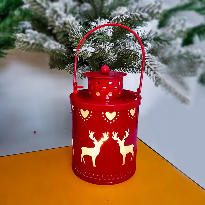 Tabletop LED Christmas lantern. Festive metal decor for holiday lighting, featuring winter scenes.