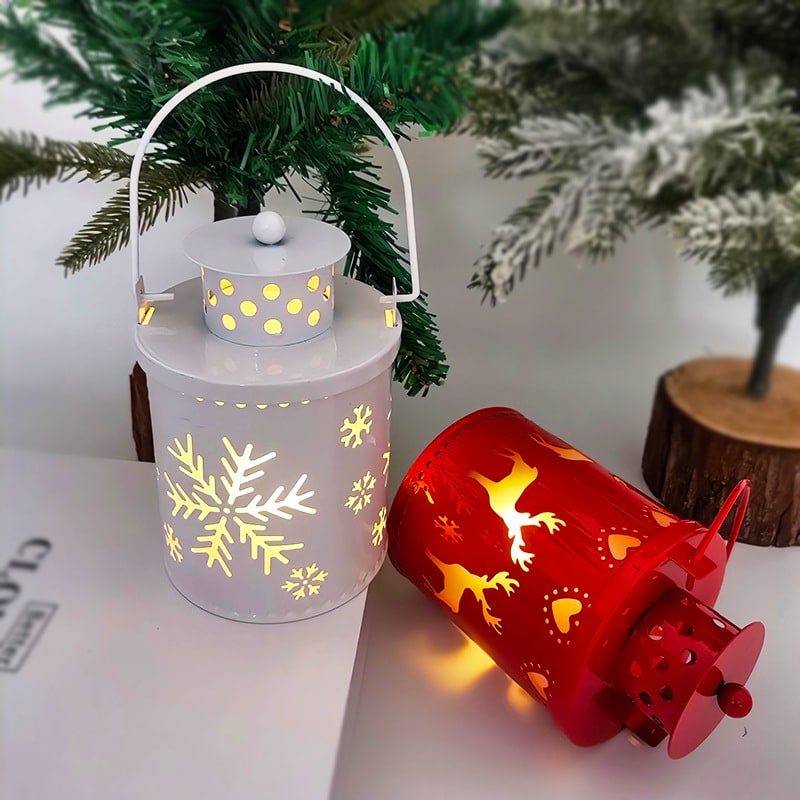 Decorative metal LED Christmas lantern. Battery-operated holiday lighting for festive winter decor.