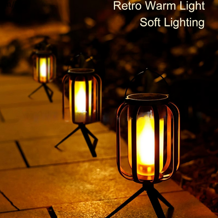Outdoor solar LED flame lantern, perfect for patio, garden, or camping, creating a warm glow.