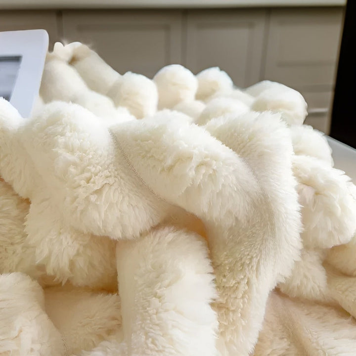 Cozy fleece blanket, perfect for adding warmth and a decorative drape to your living area.
