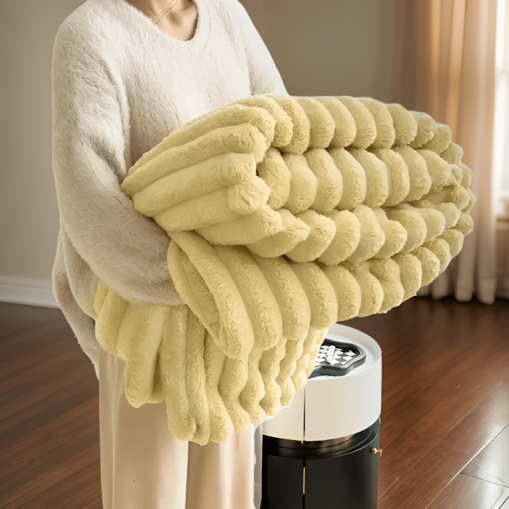 Thick, warm fleece throw blanket for chilly evenings; adds a soft touch to any space.