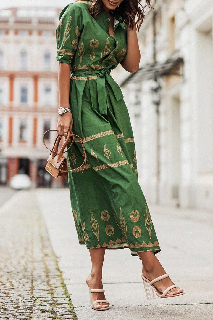 Elegant women's midi cocktail dress with vibrant geometric print, belted waist. Perfect for parties & versatile fashion.