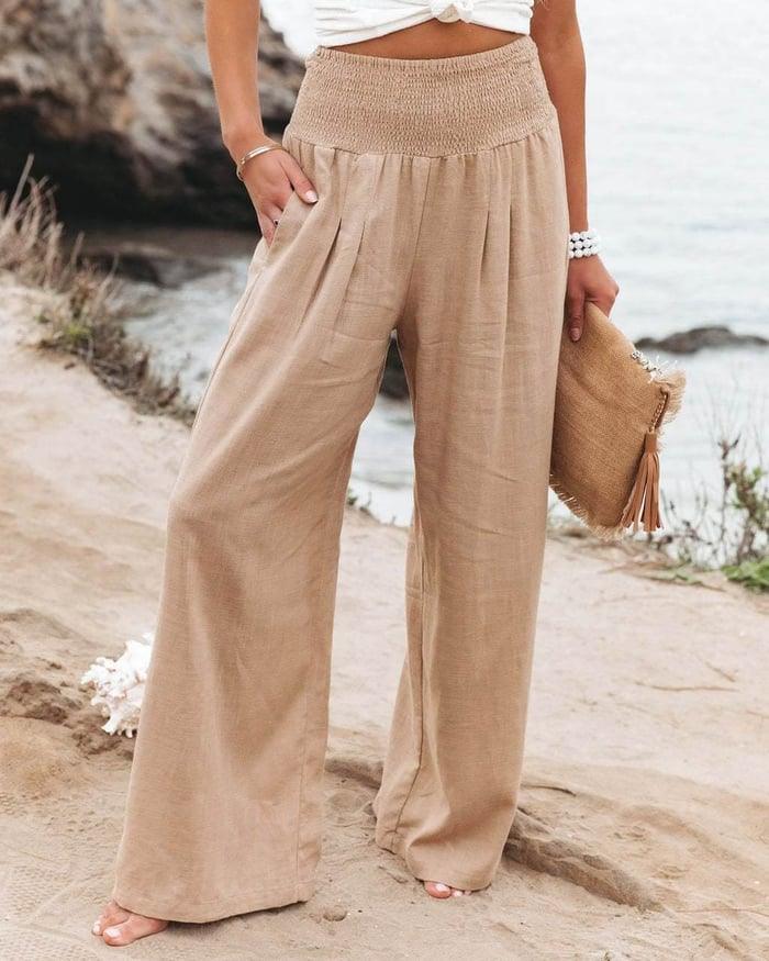 Women's timeless wide-leg smocked flowy pants, high-rise and relaxed fit for summer comfort.