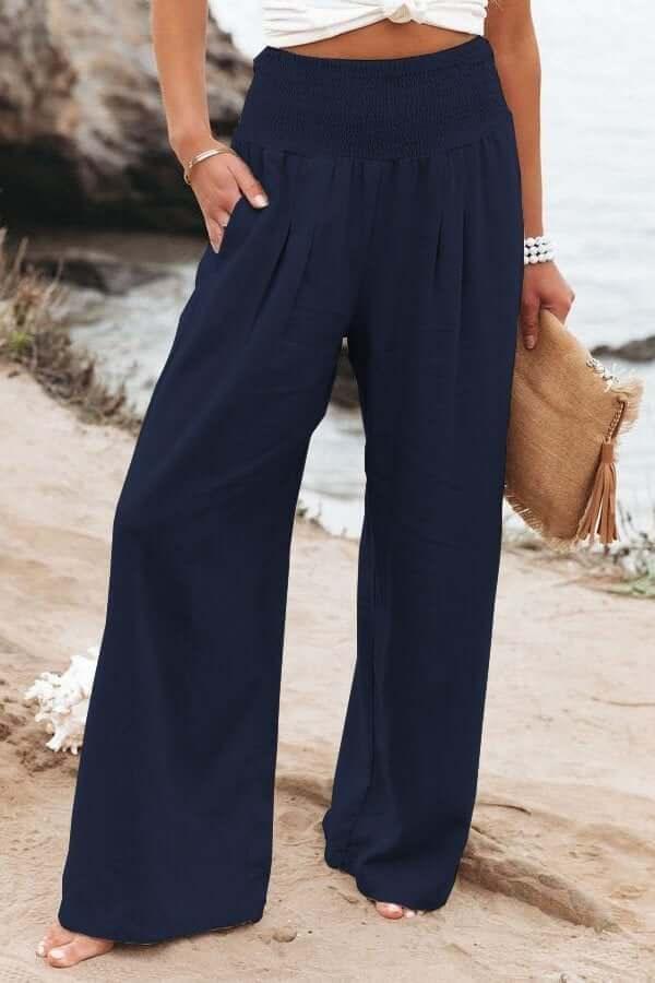 Comfortable women's wide-leg pants with smocked waist & high rise. Ideal for summer casual wear.
