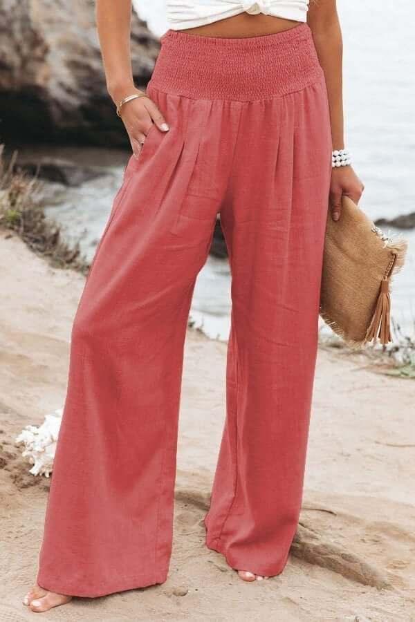 Relaxed fit women's flowy wide-leg pants, smocked for comfort. Great for vacation & casual elegance.