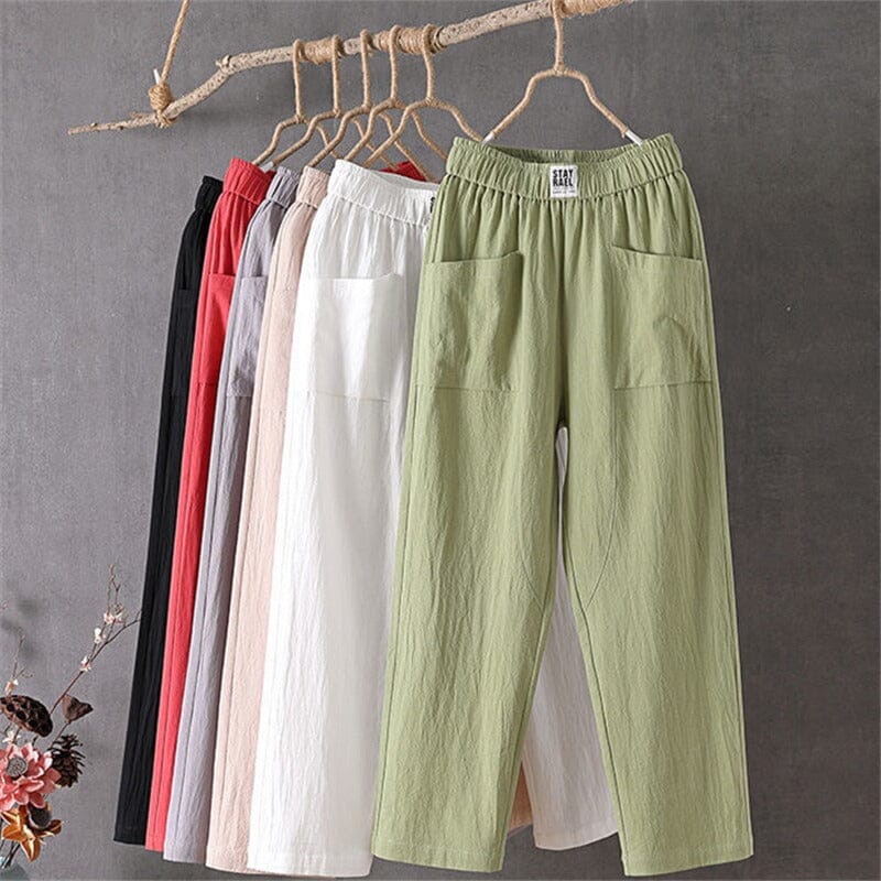 Comfortable women's linen blend trousers featuring an elastic waist, wide leg, and pockets for relaxed everyday wear.
