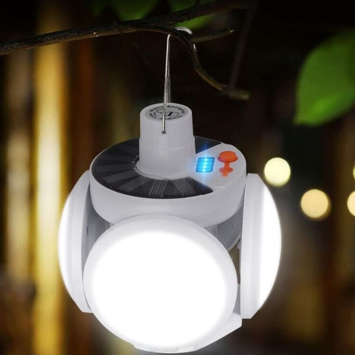 Portable solar LED bulb, multi-functional for camping, outdoor activities, and emergency illumination.