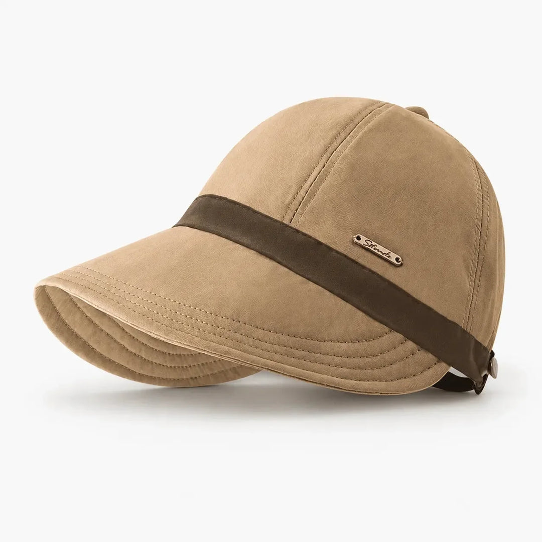 Stylish women's wide-brim sun hat, foldable UPF 50+ protection for travel, beach & summer.