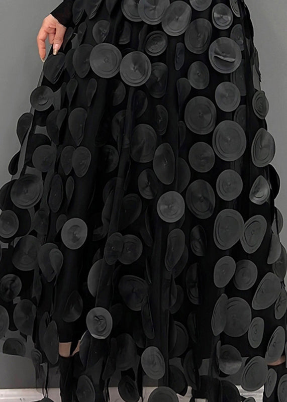 Flowy women's midi skirt with a textured A-line silhouette and elegant polka dot print.